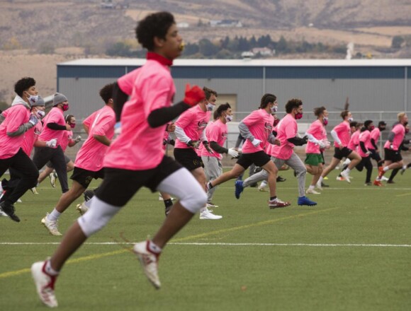 Nearly 100 football players attend Cleats Vs. Cancer minicamp at Sozo